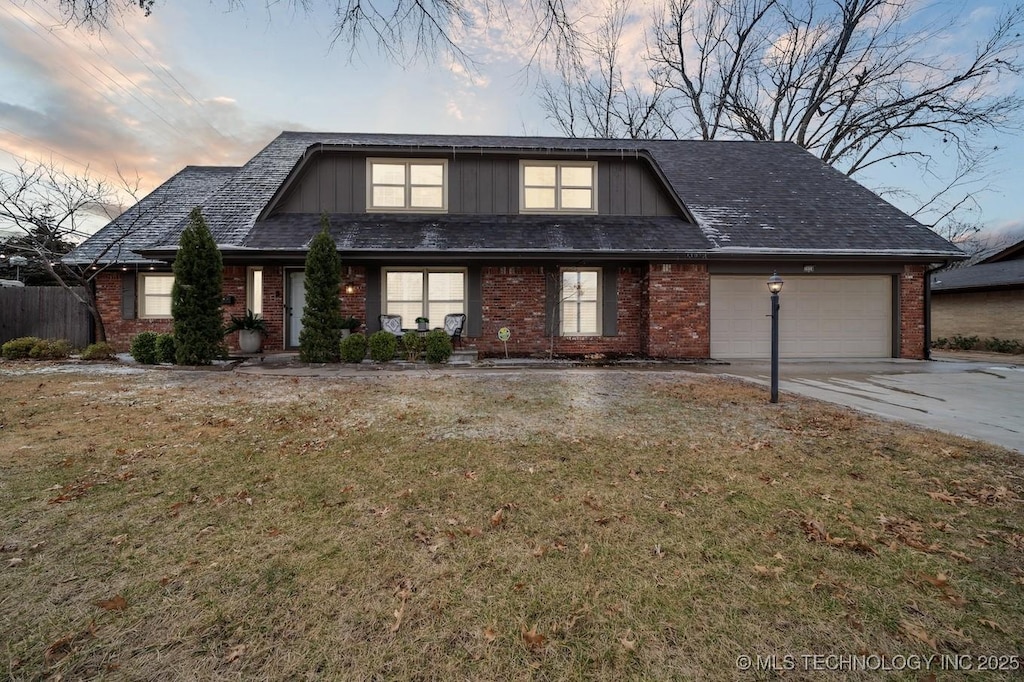 view of front property with a garage and a yard