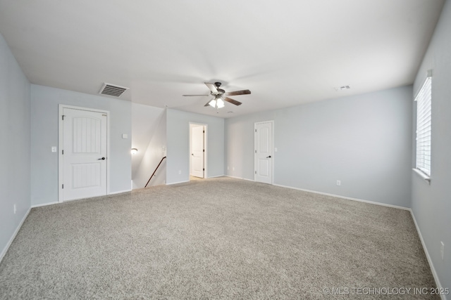 empty room with carpet floors and ceiling fan