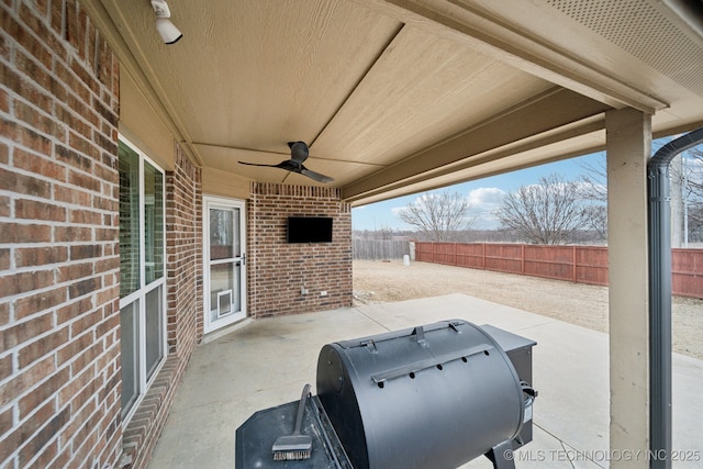 view of patio / terrace featuring area for grilling and ceiling fan