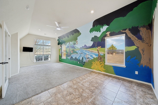 unfurnished living room with carpet, lofted ceiling, and ceiling fan