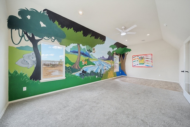 interior space featuring ceiling fan, carpet, and lofted ceiling