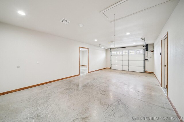 5779 W 478, Pryor, OK 74361 - garage featuring baseboards, visible vents, and recessed lighting