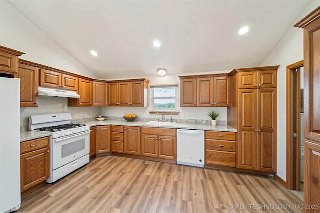 5779 W 478, Pryor, OK 74361 - kitchen with vaulted ceiling, a sink, brown cabinets, under cabinet range hood, and white appliances
