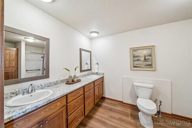 5779 W 478, Pryor, OK 74361 - bathroom with toilet, a sink, double vanity, and wood finished floors