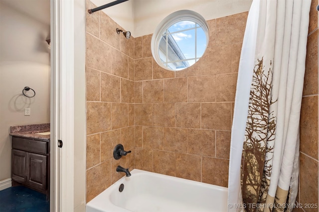 bathroom featuring vanity and shower / bathtub combination with curtain