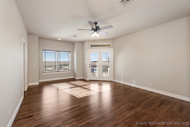 empty room with dark wood-type flooring and ceiling fan