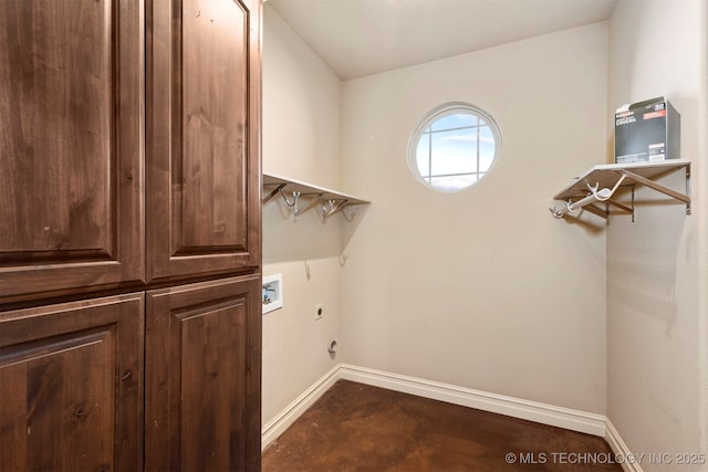 laundry room featuring washer hookup, cabinets, and hookup for an electric dryer