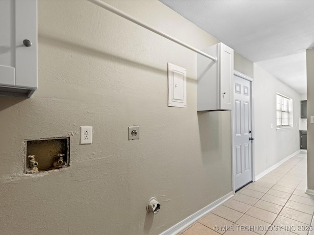 laundry area with baseboards, laundry area, hookup for a washing machine, light tile patterned flooring, and electric dryer hookup