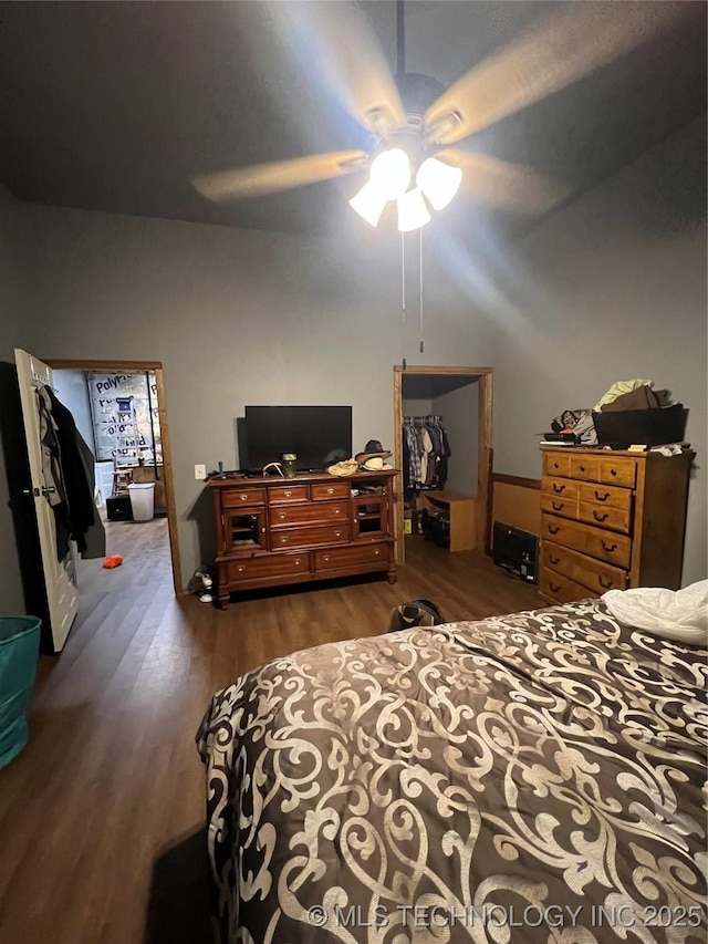 bedroom with dark wood-type flooring and ceiling fan