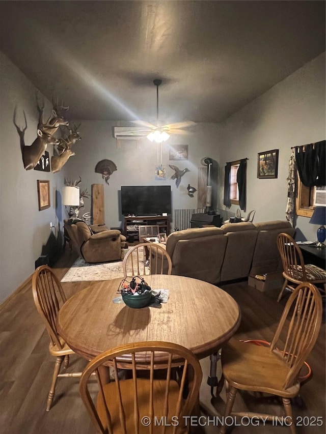 dining space with lofted ceiling, wood-type flooring, and ceiling fan