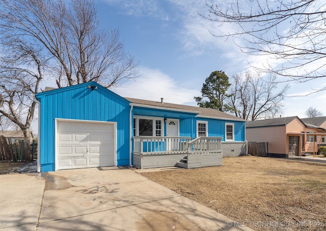 ranch-style house with a porch, a garage, and a front lawn