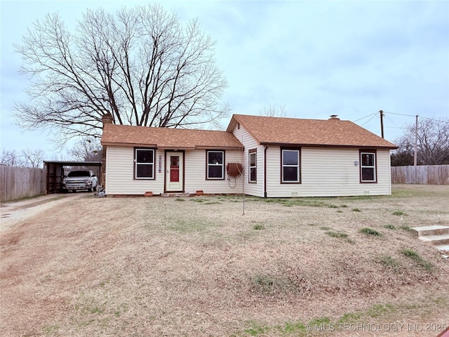 2420 3rd NE, Ardmore, OK 73401 - ranch-style home featuring a chimney, a carport, driveway, and a shingled roof