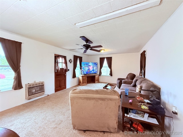 2420 3rd NE, Ardmore, OK 73401 - carpeted living area featuring heating unit and ceiling fan