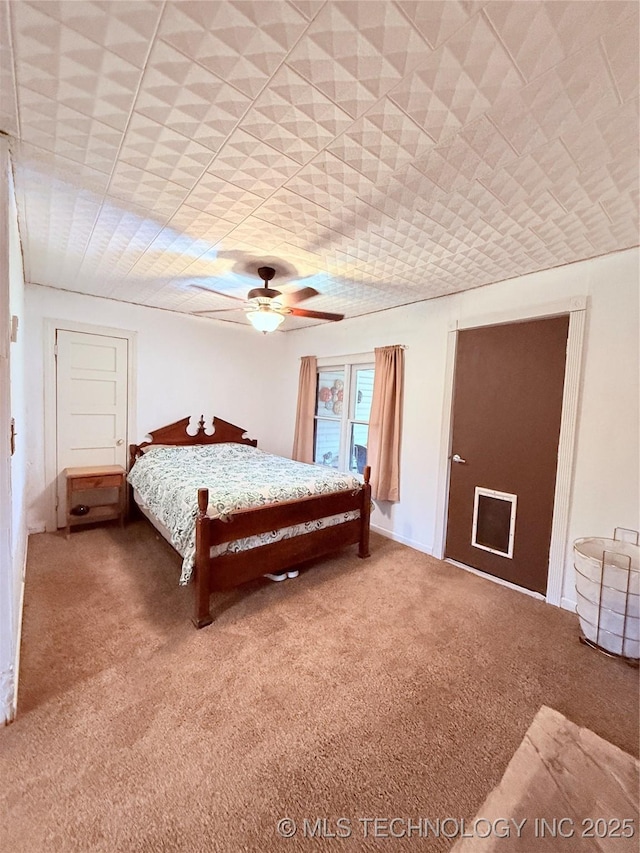 2420 3rd NE, Ardmore, OK 73401 - carpeted bedroom with ceiling fan and a drop ceiling