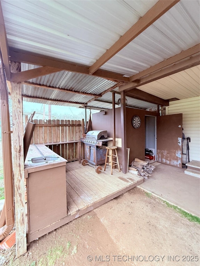 2420 3rd NE, Ardmore, OK 73401 - wooden deck featuring area for grilling and a patio