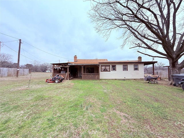 2420 3rd NE, Ardmore, OK 73401 - rear view of property with a chimney