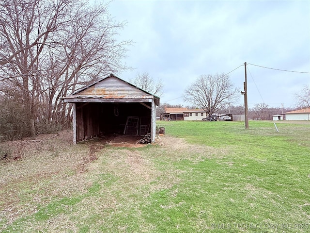 2420 3rd NE, Ardmore, OK 73401 - view of grassy yard featuring an outbuilding and a pole building