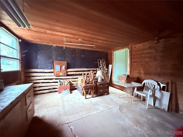 2420 3rd NE, Ardmore, OK 73401 - miscellaneous room featuring concrete floors and wood ceiling