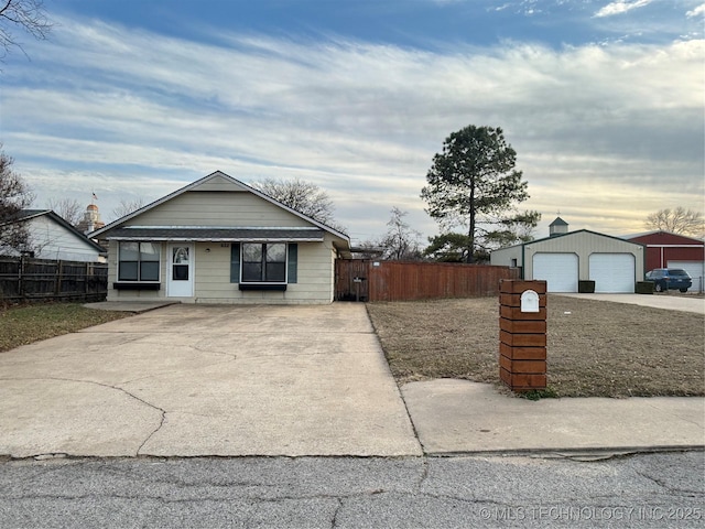 ranch-style house with an outbuilding and a garage