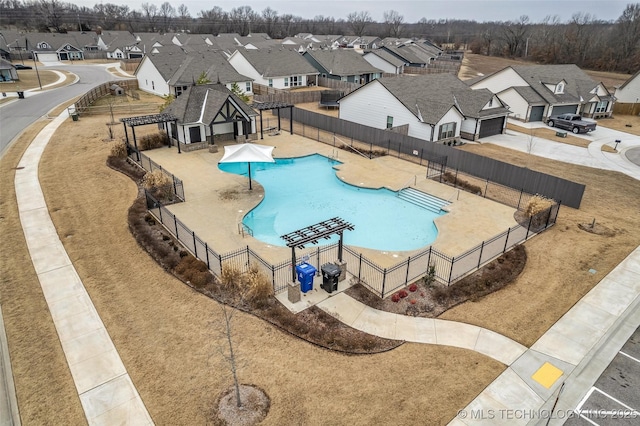 view of swimming pool with area for grilling, a pergola, and a patio