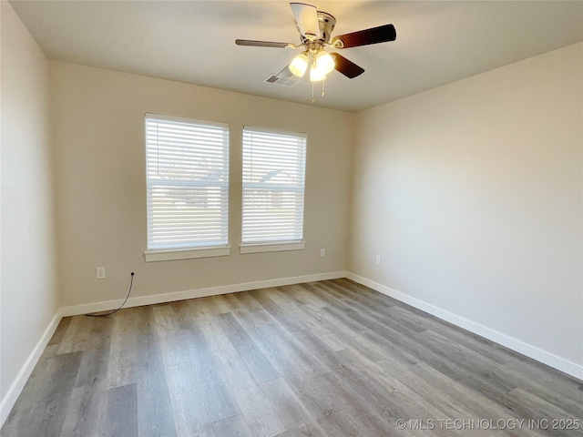 unfurnished room featuring ceiling fan and light hardwood / wood-style flooring