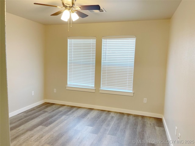 empty room with light hardwood / wood-style flooring and ceiling fan