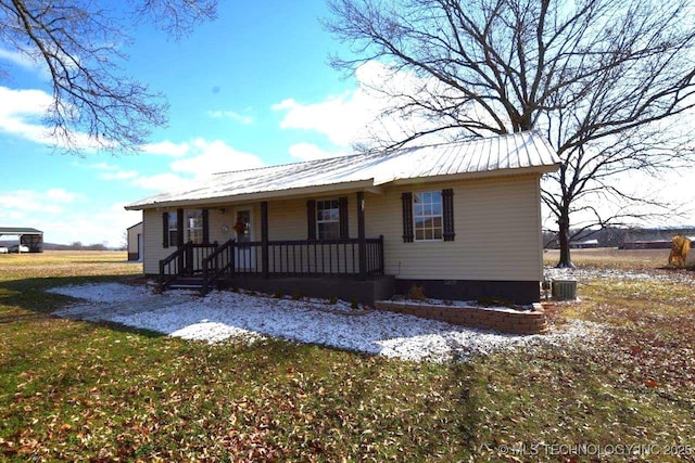 view of front of property with covered porch and a front yard