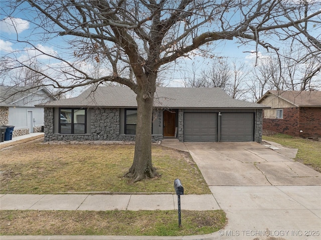 ranch-style house with a shingled roof, a front yard, driveway, stone siding, and an attached garage