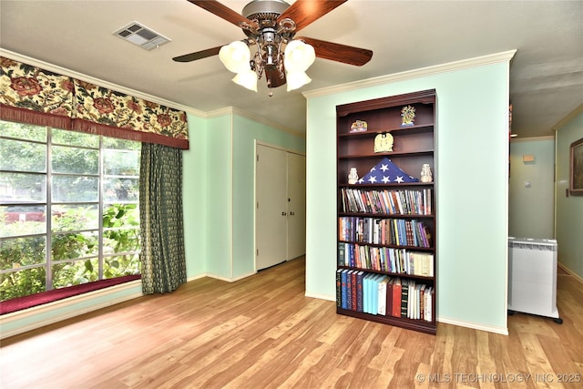 unfurnished room featuring light hardwood / wood-style flooring and ornamental molding