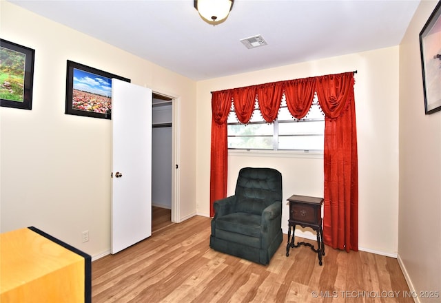 living area featuring hardwood / wood-style floors