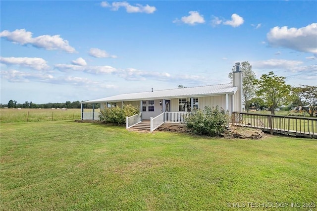 back of house with a lawn