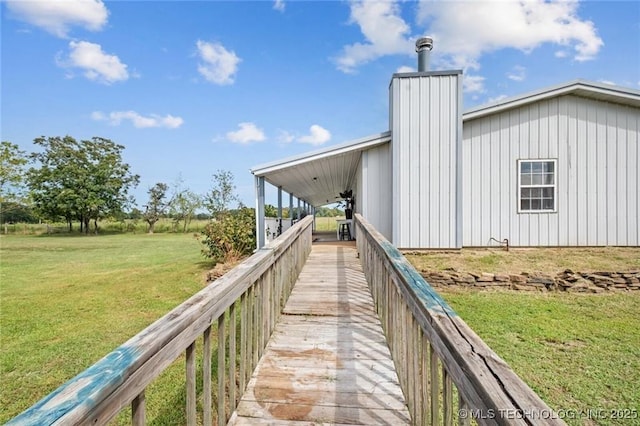 rear view of property with a yard