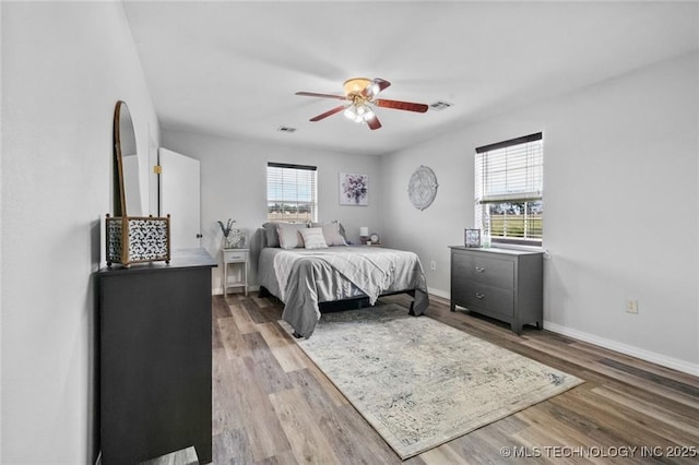 bedroom featuring ceiling fan and hardwood / wood-style floors