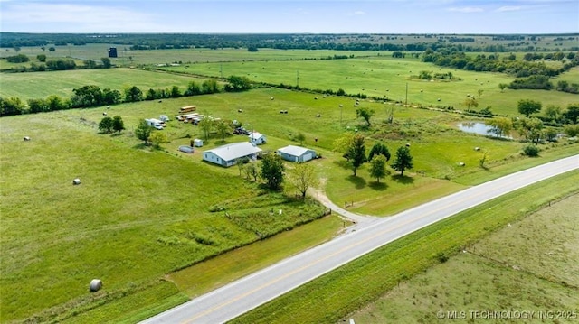 aerial view featuring a rural view and a water view