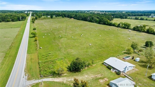 birds eye view of property featuring a rural view