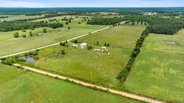 drone / aerial view featuring a water view and a rural view