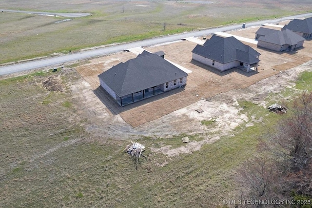 birds eye view of property featuring a rural view