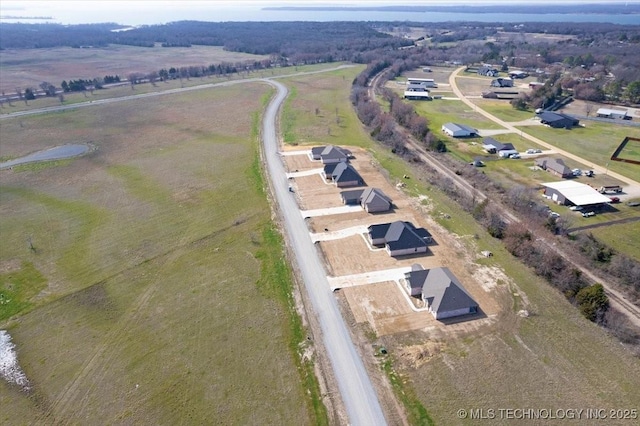 birds eye view of property featuring a rural view