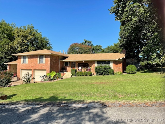 view of front of home with a garage and a front yard