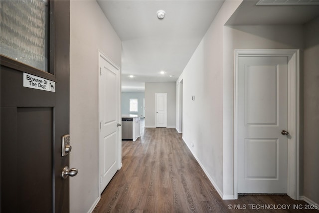 corridor featuring hardwood / wood-style floors