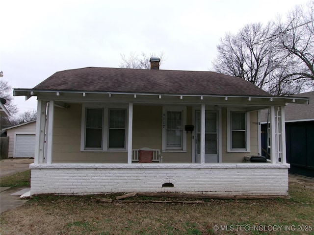 view of front of house with a garage and a porch