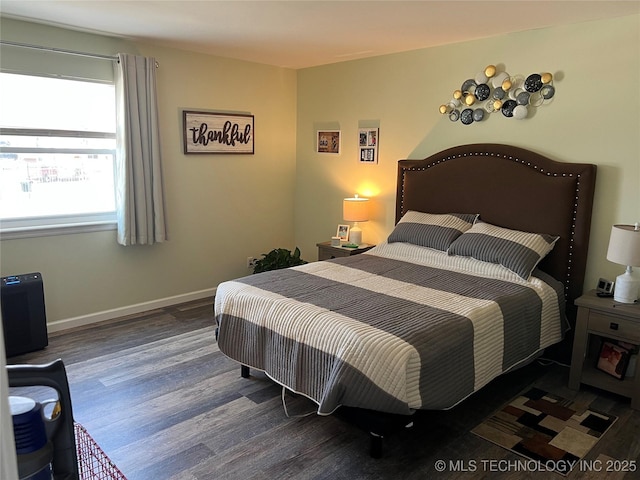 bedroom with dark wood-type flooring