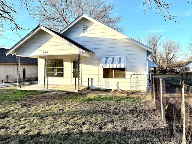 rear view of house with a porch