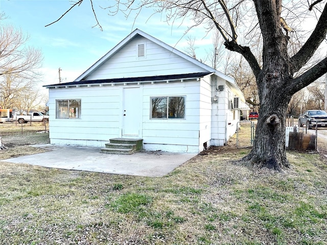 rear view of property featuring a patio