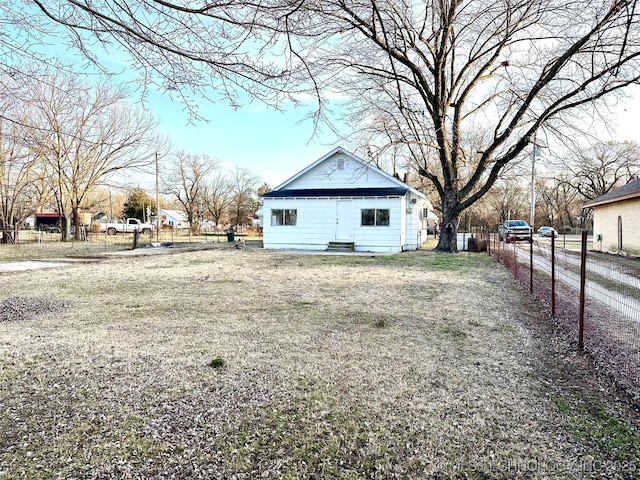 view of side of home featuring a lawn