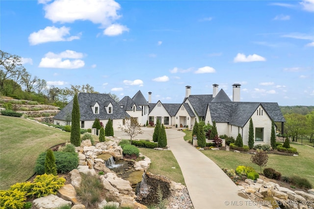 view of property's community featuring a residential view and a yard