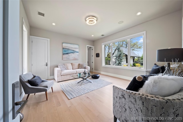 interior space featuring recessed lighting, light wood-type flooring, visible vents, and baseboards