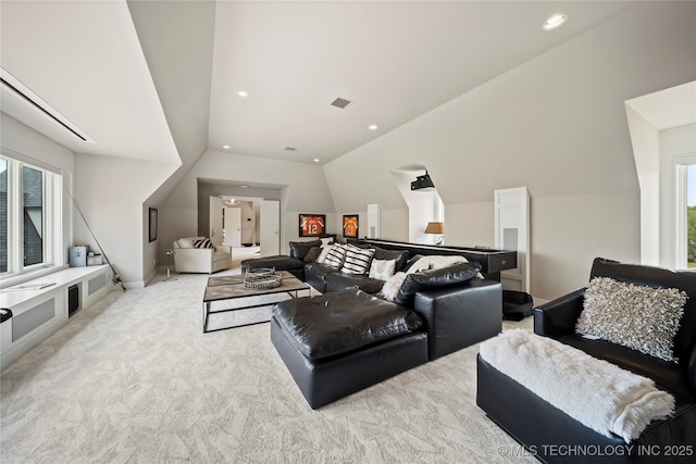 home theater room with lofted ceiling, recessed lighting, visible vents, and light colored carpet