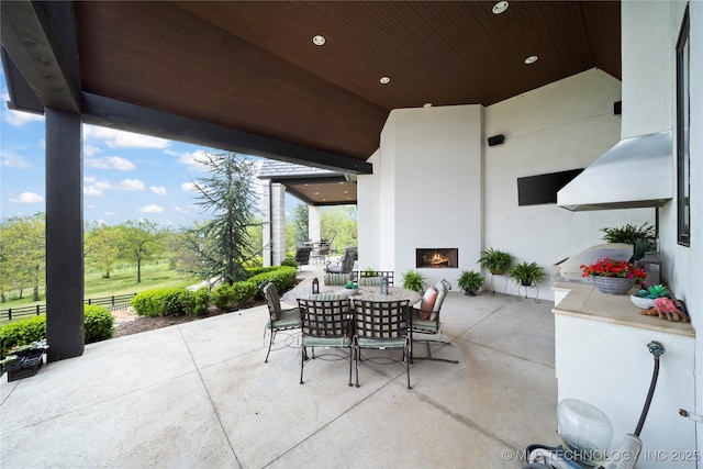 view of patio featuring outdoor dining area