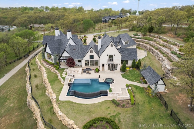 view of swimming pool featuring a patio area, a fenced backyard, and a yard